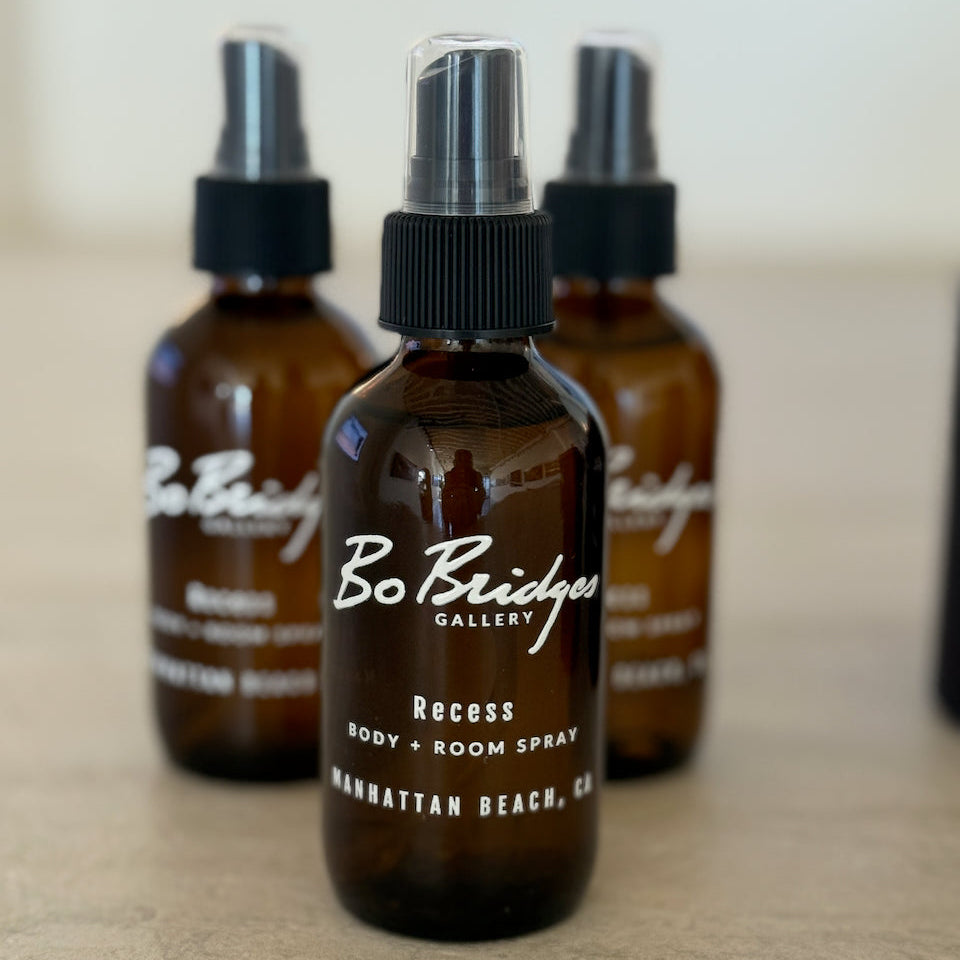 Three brown spray bottles with black caps on a light surface, featuring 'Bo Bridger' branding.