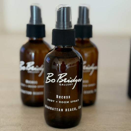 Three brown spray bottles with black caps on a light surface, featuring 'Bo Bridger' branding.